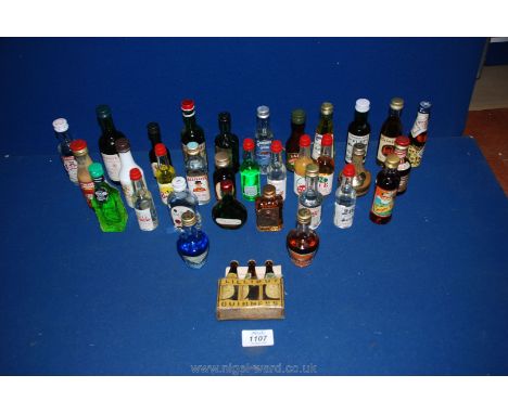 A box of miniature alcohol bottles to include; Irish Cream Liqueur, Cointreau, Gordon's Gin, etc.