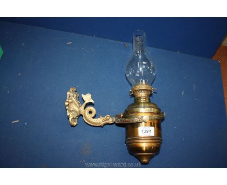 A Gimbal ship's oil Lamp with ornate 'dolphin' wall bracket, by E. Miller &amp; Co. USA, probably from a first class cabin or