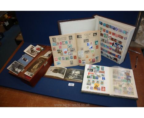 A small album of vintage portrait postcards, two stock books and a small album containing Commonwealth stamps, along with a w
