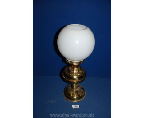 A Brass oil Lamp with white glass shade