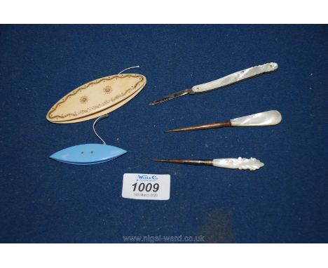 A small penknife, a bone weaving tool and others.