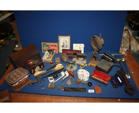 A box of miscellanea including a wooden box, brass wall bell, Instamatic camera, glasses, horse, dog on marble base etc.