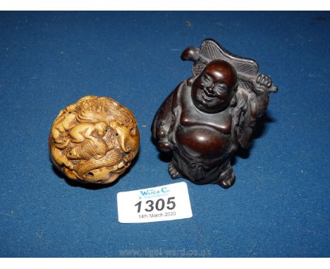 A circular Netsuke and a Buddha.