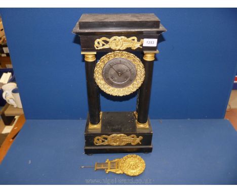 A French 19th c. ebonised pillar Clock with brass and gilt decoration.