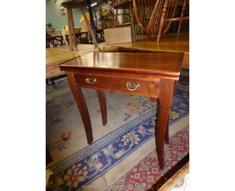 A darkwood single swing leg flap-over Card Table standing on swept legs, having a frieze drawer with brass backplate handles,