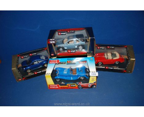 Four Burago model cars including VW Beetle, Freelander, Porsche and Bugatti (boxed)