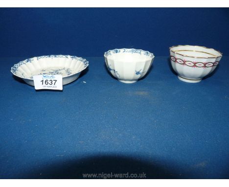 A rare 1786 Worcester tea bowl and saucer with twenty-four vertical pointed flutes, hand painted with flowering rock and long