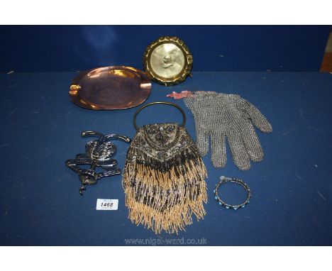 A box containing old purse, chain mail glove, bangle, copper ash tray etc.