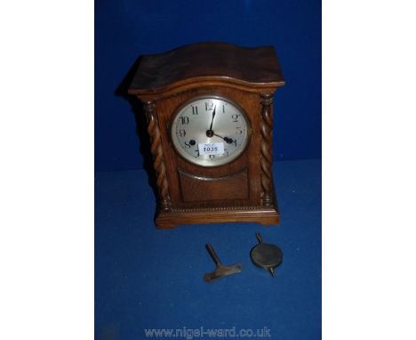 A Mantle Clock with twisted columns, with key.