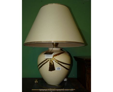 A Louis Drimmer table Lamp and matching cream shade (with original labels).