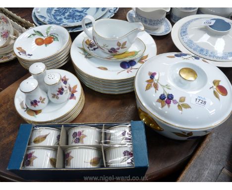 A quantity of Royal Worcester 'Evesham' dinnerware including plates, bowls, gravy boat, tureen, salt and pepper pots, etc.