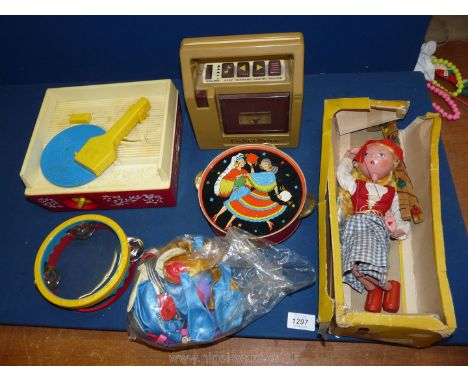 A Pelham puppet and vintage toys including tambourine, Fisher Price record player, etc.