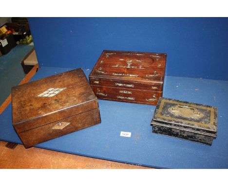 Two wooden boxes with mother of pearl decoration to the top plus a black metal money box.