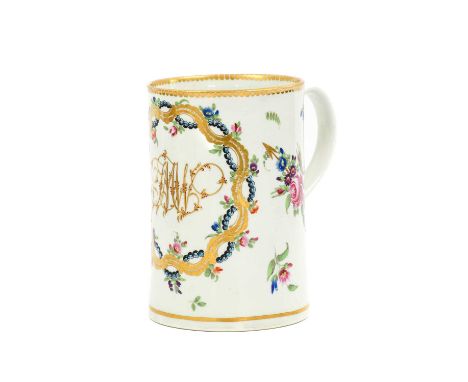 A Worcester Porcelain Mug, circa 1780, of cylindrical form, with gilt monogram JMW within a foliate and scroll cartouche flan