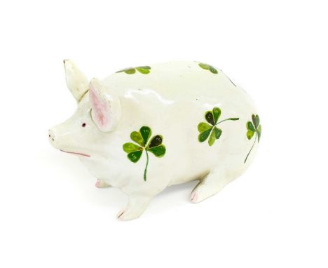 A Wemyss Bovey Pottery Model of a Pig, circa 1930, painted with shamrock motifs, painted mark15cm longPatch of glaze lacking 