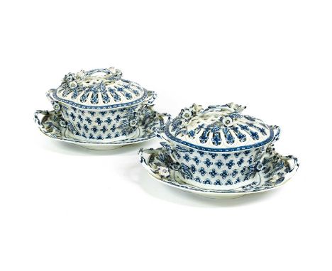 Two Worcester Porcelain Chestnut Baskets, Covers and Stands, circa 1775, of quatrefoil form, with rustic branch handles appli