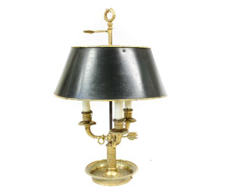 A French Gilt Metal Bouillotte Lamp, restoration, circa 1830, with wreath finial, adjustable toleware shade over three leaf-s