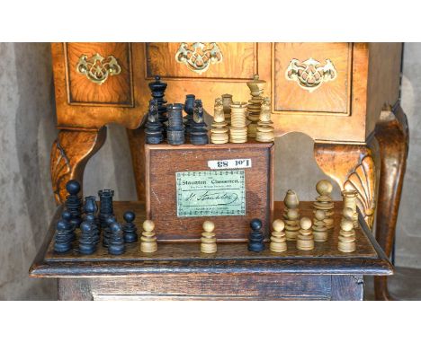 A Boxwood and Ebonised St George Pattern Chess Set, late 19th century, in associated Jaques &amp; Son sliding box with paper 