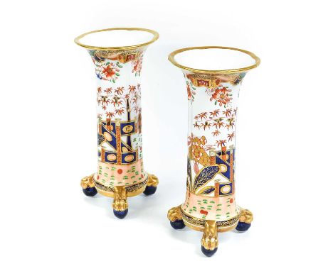 A Pair of Spode Porcelain Vases, circa 1820, of tapering quatrefoil form and on ball and paw feet, painted in the Imari style