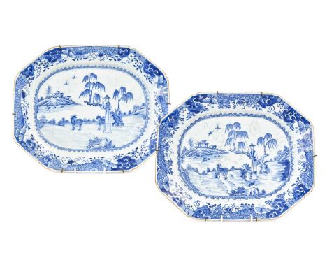 ~A Pair of Chinese Porcelain Platters, 18th century, of canted rectangular form, painted in underglaze blue with goat herders