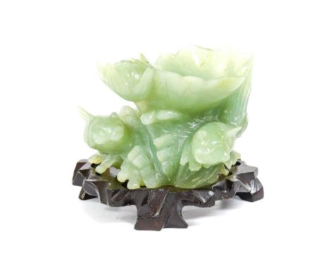 A Jade-Type Brush Washer, as a water lily, pad and flower flanked by two Koi carp13.5cm long, on a hardwood base