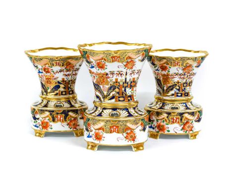 A Spode Porcelain Garniture of Three Pot Pourri Vases on Stands, circa 1820, of tapering scalloped form and on pierced stands