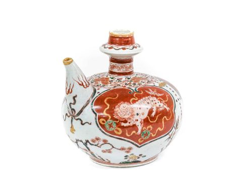 A Japanese Porcelain Kendi, 19th century, of typical form, painted with Buddhistic lions and brocade balls in three red panel
