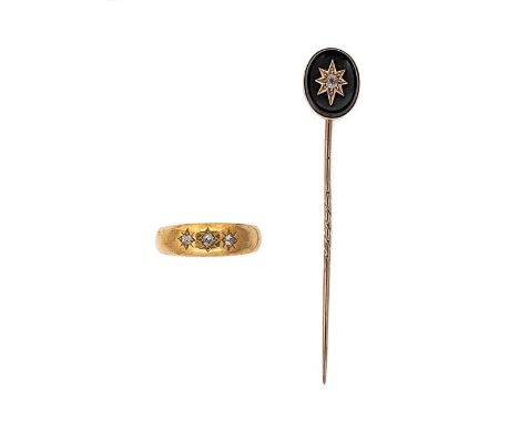 An 18ct gold three stone diamond ring together with a diamond set stick pin, the first, a ring set with three diamonds, each 