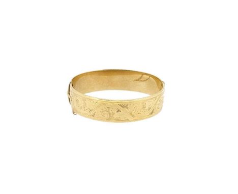 A half engraved hinged bangle, front section engraved with a scroll and foliate design, plain polished back section, push-in 