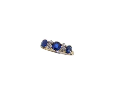 A sapphire and diamond half hoop style ring, three claw set oval faceted sapphires, length from 4.3 to 4.7mm, spaced by four 