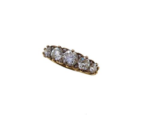 A diamond set carved half hoop ring, five graduated old brilliant cut diamonds, from approximately 3.5 to 5.3mm, further set 
