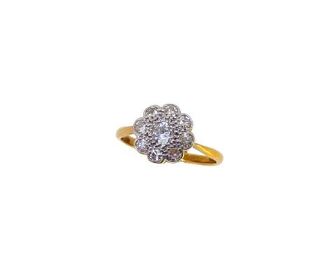 A diamond set daisy cluster ring, central round brilliant cut diamond, approximate diameter 3.7mm, surrounded by eight single