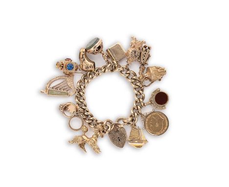 A late 20th century charm bracelet, curb style links, suspending thirteen charms, hallmarked or assessed as 9ct gold, includi