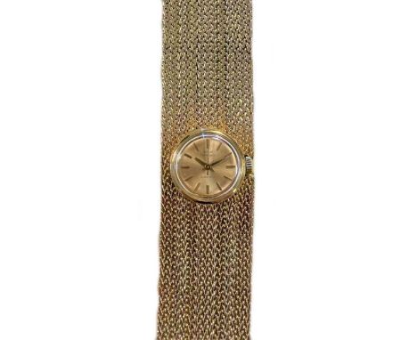 Girard Perregaux - A Swiss cuff style wristwatch, circa 1960, the signed circular champagne dial, 17mm diameter, with gold ba