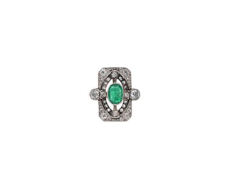 An emerald and diamond panel ring, rectangular frame with a central rubover set oval faceted emerald, approximately 7.6 x 5.6