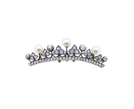 A pearl and diamond brooch, three button shaped pearls (untested), approximate diameter from 6.7 to 7mm, four graduated old b