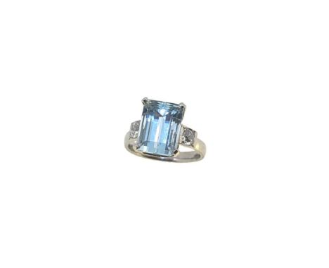 A platinum aquamarine and diamond ring, claw set octagonal aquamarine, approximately 12.6 x 9.2mm, estimated approximate weig