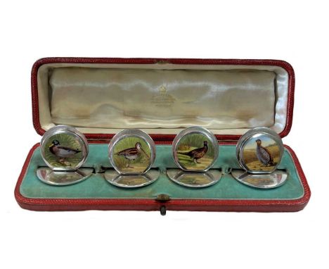 A set of four early 20th century silver and enamel menu holders, mark of Sampson Mordan &amp; Company, Chester 1904, each sta