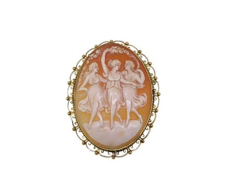 A cameo brooch, shell cameo depicting the three graces, decorative scroll border, dimensions 7 x 5.5cm, pin and hook fitting 