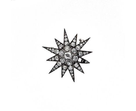 A Victorian diamond set star brooch, central old cushion cut diamond, approximately 5.1 x 4.9mm, estimated approximate weight