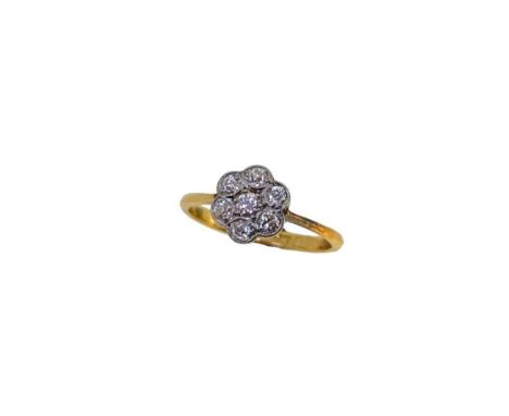 An early 20th century diamond cluster ring, seven old brilliant cut diamonds, estimated approximate total diamond weight 0.25