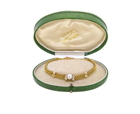 An early 20th century pearl and diamond bracelet, two rows of curb links set with a central oval shaped pearl (untested), app