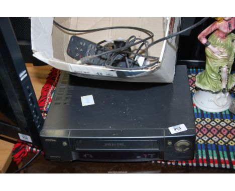 A Sanyo video cassette recorder and remote.