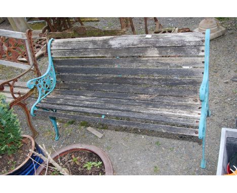 A garden bench with cast iron back and sides, 50" wide x 27" high.