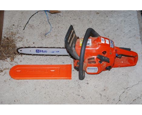 A Husqvarna 120 Chainsaw 12" cutter bar, chain brake, good compression.