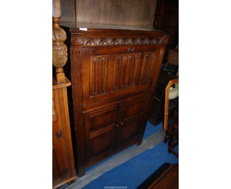 An Oak linen fols drinks cabinet, 31 1/2" wide x 19" deep x 4' high.