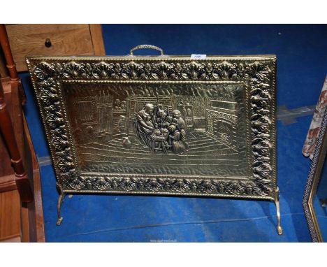A brass fire screen.