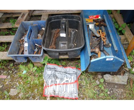 A metal tool box with 11 piece combination spanner set, allen keys etc.