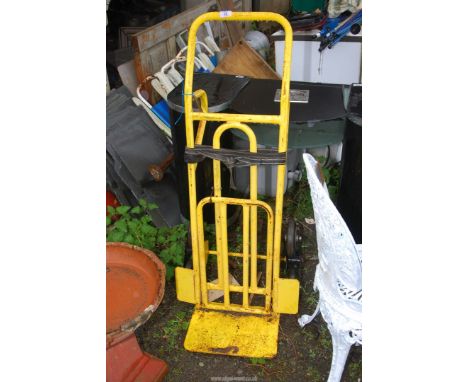 A yellow step walker sack truck.