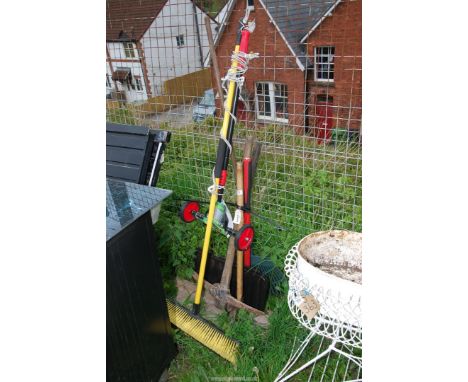 An axe, sledge hammer, clothes airer, brush etc.